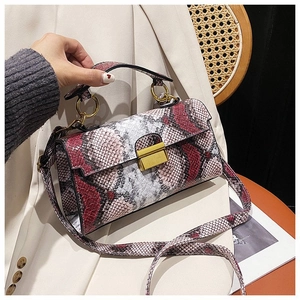 Vintage snake skin crossbody bag with red, grey, and white patchwork and gold hardware