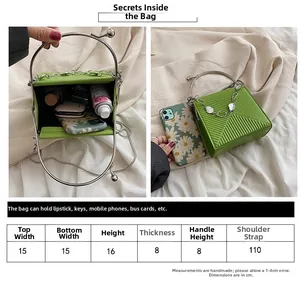 Detailed size chart for a green quilted crossbody bag with metal ring handles