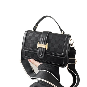 Classic black checkered crossbody bag with gold buckle and adjustable wide canvas strap