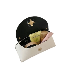 White pearl fashion handbag with gold magnetic closure and spacious interior storage