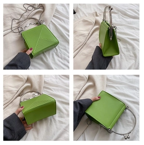 Bright green square handbag featuring geometric embossed texture and silver metal handle