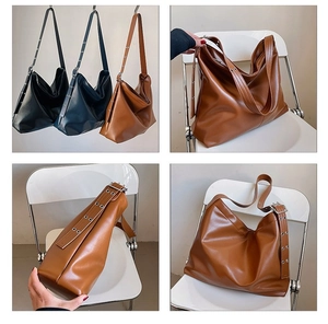 Vue détaillée du grand sac cabas en cuir PU avec bandoulières à œillets métalliques