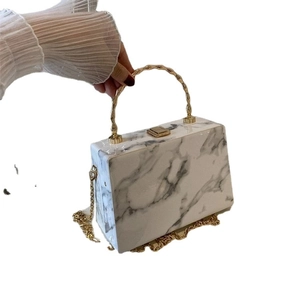 Elegant white marble box bag with golden ring handle and chain strap for women