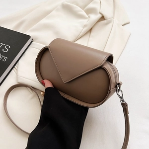Brown vintage faux leather crossbody bag with envelope flap and silver hardware details