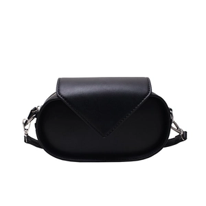 Classic black oval crossbody bag with minimalist triangle flap and adjustable strap