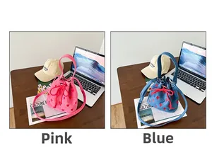 Detailed comparison of pink and denim blue canvas bucket bags with red heart patterns