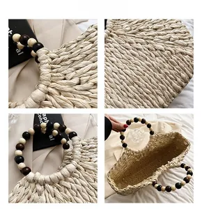 Detailed views of beige straw handbag featuring multi-colored wooden bead circular handles