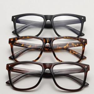 Close-up of square glasses frames in matte black and tortoiseshell with size markings