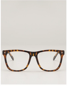 Detail of tortoise shell square glasses frame with metallic studs on a grey background