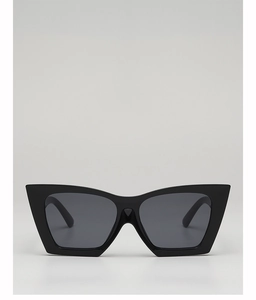 Close-up of thick black cat-eye sunglasses with premium dark grey tinted lenses
