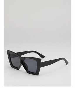 Close-up of black thick-frame cat-eye sunglasses with wide temples and dark lenses