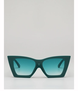Detail view of stylish dark green cat-eye sunglasses with gradient lenses and thick frame