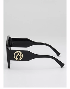 Detail view of black square sunglasses featuring a golden round logo on the side temple