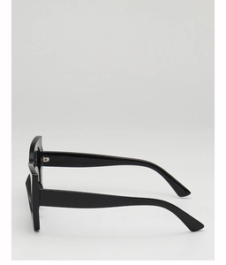 Side view of sleek black sunglasses featuring wide temples and a minimalist modern design