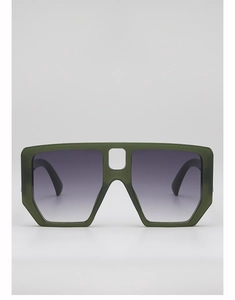 Detail of oversized dark green square sunglasses with hollow nose bridge and gradient lenses