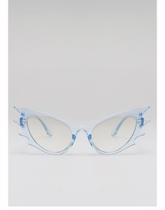 Detail of light blue bat-shaped polygon sunglasses with transparent fashion lenses
