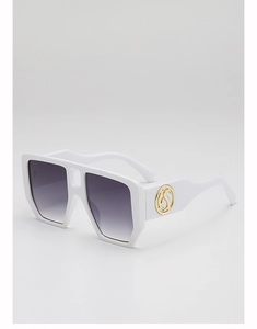 Detail of white square oversized sunglasses featuring a golden round hollow S logo on the temple