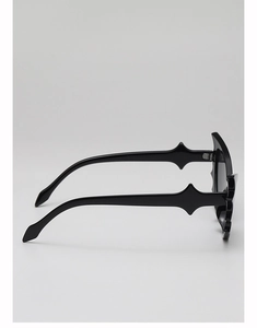 Side view of black bat-shaped sunglasses featuring edgy geometric temple design