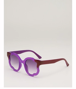 Macro detail of purple wavy frame sunglasses with gradient lenses and vibrant edges