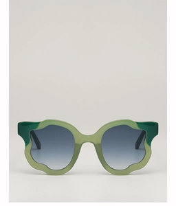 Detail of irregular wave frame sunglasses with green accents and purple gradient lenses