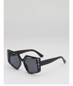 Detail of square oversized sunglasses with chic black and white zebra pattern on frame
