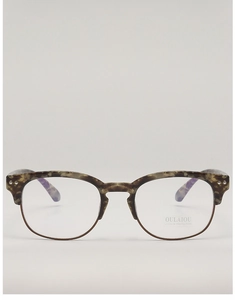 Detailed macro view of the semi-rimless browline frame with tortoiseshell top and metallic rim