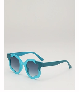 Macro 45-degree angle of light blue wavy frame sunglasses with grey gradient lenses