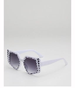 Close-up of white oversized square sunglasses featuring purple checkerboard patterns