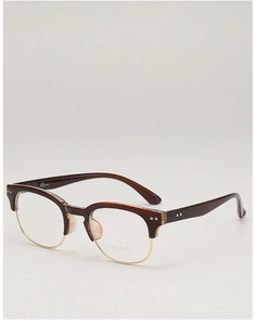 Detail of retro semi-rimless browline glasses with gold metal wire and brown frame