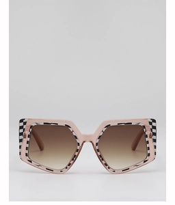 Close-up of pink square sunglasses with checkerboard pattern and gradient brown lenses