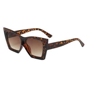 Fashionable leopard print sunglasses with oversized geometric frames and brown gradient lenses