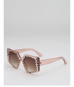 Detail of square oversized sunglasses featuring a checkered pattern and gradient lenses