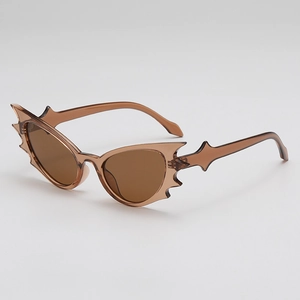 Retro bat-shaped sunglasses with translucent brown polygonal frames and jagged wing design