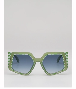 Detail of green hexagonal sunglasses with checkerboard pattern and blue gradient lenses