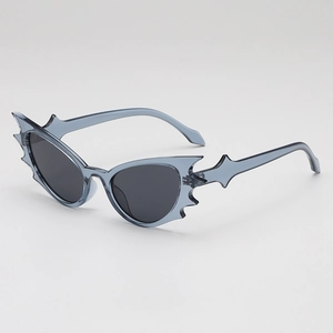 Gothic bat-wing shaped sunglasses with semi-transparent grey-blue frames and dark lenses