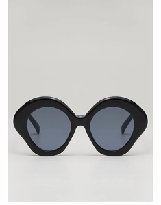 Front view of stylish black oversized sunglasses with thick frames and dark lenses