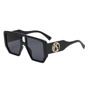 Chic oversized square sunglasses with black geometric frame and golden logo on the temple