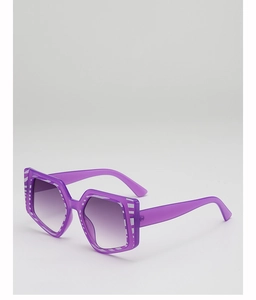 Macro detail of purple oversized hexagonal sunglasses with stylish white striped frame accents