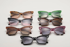 Detailed close-up of cat-eye sunglasses collection in various trendy colors and frame finishes