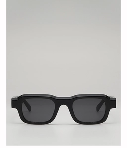 Front view of stylish thick rectangle sunglasses with solid black frames and dark lenses