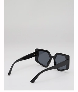 Close-up of stylish black geometric square sunglasses with thick frames and dark lenses