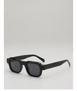Detail view of bold black square sunglasses with thick frames and premium UV protection