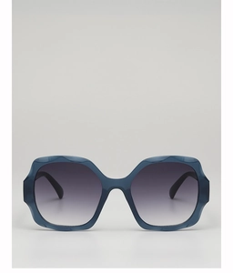 Detail of scalloped thick navy blue sunglasses frame with vertical gradient lenses