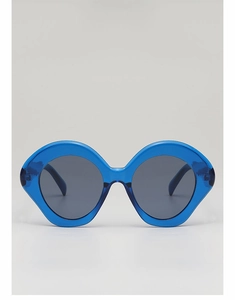 Detail of trendy blue transparent resin sunglasses frame with dark gray lenses