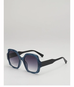Detail of dark blue translucent geometric sunglasses frame with grey gradient lenses