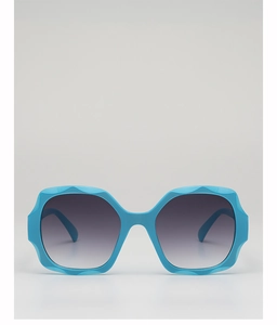 Front view of trendy oversized blue wavy hexagon sunglasses with gradient grey lenses