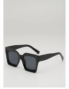 Close-up of black square sunglasses with wide temples and high-gloss resin finish