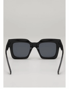 Detail view of the sturdy black square frame and dark lenses of hip hop punk sunglasses