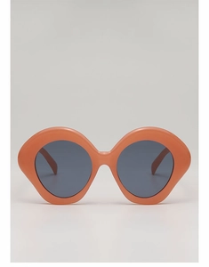 Detail of oversized orange geometric sunglasses frame with dark grey circular lenses