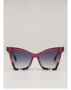Detail of cat eye sunglasses with magenta frame, tortoise pattern, and gradient lenses